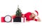 Woman lying down with clock,notebook, christmas tree and gifts