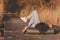 Woman lying on the lake docks