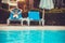 Woman lying on a lounger by the pool