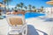 Woman lying on a lounger by the pool at the hotel