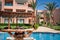 Woman lying on a lounger by the pool at the hotel