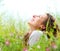 Woman lying in Meadow of Flowers