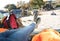 Woman lying on sleeping bag inside of camping tent