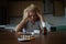 Woman lying at the table, depressed, lonely, sick, despondent, unhappy, suffering, among pills