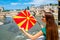 Woman with macedonian flag in Skopje city center