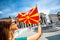 Woman with macedonian flag in Skopje city center