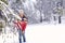 Woman  in magic winter day.Young woman enjoying the snowy day