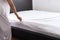 Woman make a bed,Female making white bed in room after wake up at home