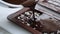 Woman make homemade chocolate candy bar with nuts