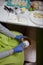 A woman makes a marshmallow mass with a blender. Freshly cooked marshmallows on a tray nearby. Cooking sweets during a pandemic