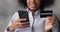 Woman makes purchase using smartphone and credit card, closeup