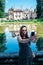 Woman makes a selfie with the Mateus Palace in Vila Real