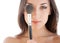 Woman with makeup brush