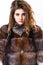 Woman makeup calm face hair volume hairstyle. Winter hair care tips you should follow. Hair care concept. Girl fur coat