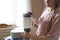 Woman making almond milk in a blender