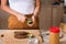 Woman making avocado peanut butter toast for a healthy breakfast