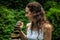 Woman making balance stones. Close up of young Caucasian woman. Balance, meditation, relaxation, peaceful nature. Ubud, Bali,