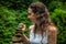 Woman making balance stones. Close up of young Caucasian woman. Balance, meditation, relaxation, peaceful nature. Ubud, Bali,