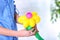 Woman making balloon figure on blurred background