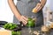 Woman making basil pesto sauce