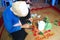 Woman making betel with betel and areca