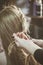 Woman making braids at hair studio