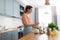 woman making cocktail drinks at home kitchen