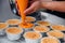 Woman during making decorating cooking bakery cake