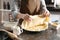 Woman making delicious chicken pot pie