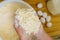 Woman making dough for chewy cheese bread