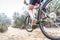 Woman making downhill with mountain bike. Concept about people a