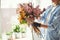 Woman making an exquisite spring floral arrangement