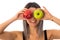 Woman making eyes with two apples