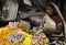 Woman Making Flower Garlands at Her Stall