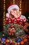 Woman making handmade christmas wreath on table. Christmas decoration and composition. Girl dressed in christmas design