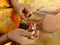 Woman making henna painting, India