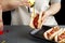 Woman making hotdog sandwiches at home