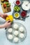 Woman Making Mini Tropical Fruit Pavlovas