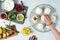 Woman Making Mini Tropical Fruit Pavlovas