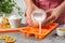 Woman making natural handmade soap at stone table, closeup