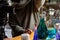 Woman making perfume with test tubes in craft workshop