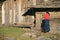 A woman is making a phone call in a village near Gangtey (Bhutan)