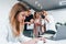 Woman making photo by camera. Group of business people in formal clothes indoors in the office