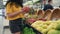 Woman making purchases in supermarket, woman choosing products at supermarket for cooking, healthy foods fruits, dragon