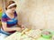 Woman making russian meat dumplings