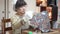 A woman making a stained glass lamp