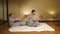 Woman making thai massage to a man