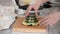 Woman making a waffle cups for ice cream.