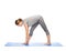 Woman making yoga intense stretch pose on mat