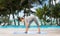 Woman making yoga intense stretch pose on mat